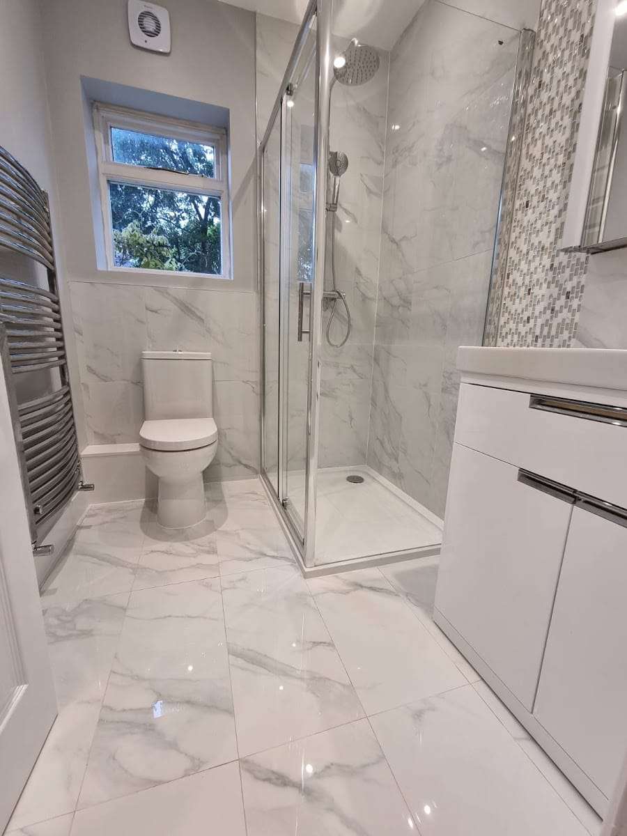 Marble effect shower room, by Briland Demja